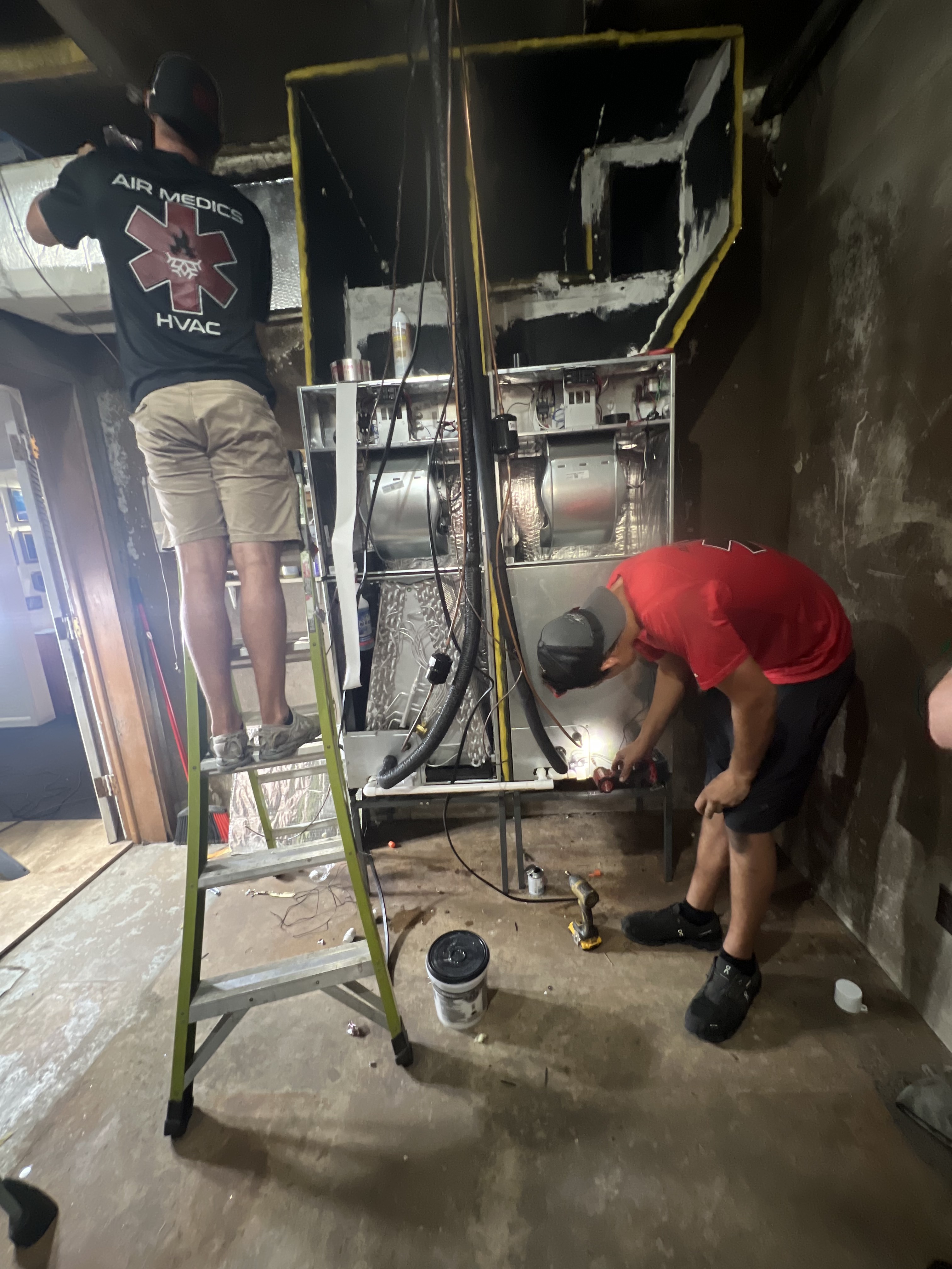Air Medics technicians installing furnaces and ductwork